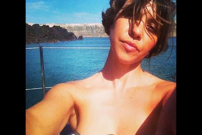 Kourtney pulls a sexy selfie pose in front of yet another perfect tropical horizon. We're officially jealous now.
