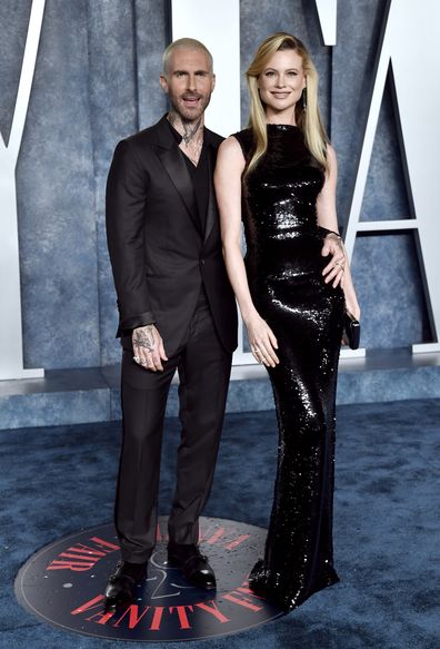 Adam Levine, left, and Behati Prinsloo arrive at the Vanity Fair Oscar Party on Sunday, March 12, 2023, at the Wallis Annenberg Center for the Performing Arts in Beverly Hills, Calif. (Photo by Evan Agostini/Invision/AP)