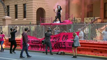 A protest is underway outside NSW Parliament. 