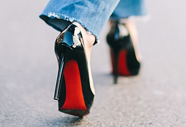 "Sammy" red-soled shoes are trademarked by which designer?