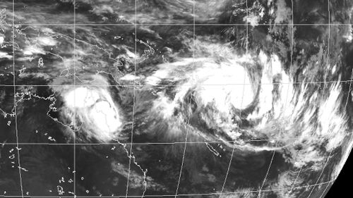 Queensland residents warned to stay vigilant despite likelihood of Cyclone Nathan remaining at sea