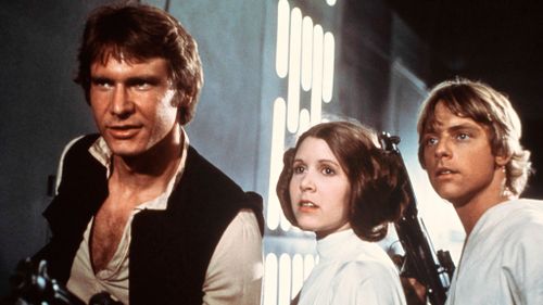 Fisher, in Star Wars: Episode IV - A New Hope, with co-stars Harrison Ford (left) and Mark Hamill.