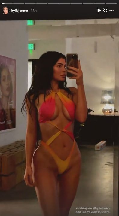 Kylie Jenner teases new swimwear line with racy selfie.