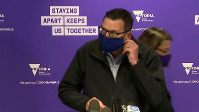 Victoria Premier Daniel Andrews wears face mask.