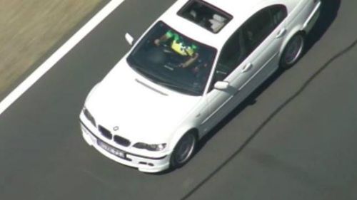The white BMW sedan pursued by police. (9NEWS)