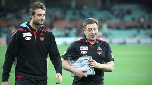 Thompson (right) coached Essendon until 2014. (AAP)