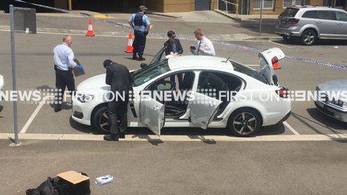 Police search a car during the operation. (Supplied)