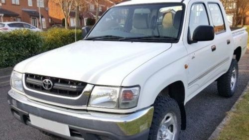 The white Toyota Hilux has the number-plate 098-HYX. (QLD Police)