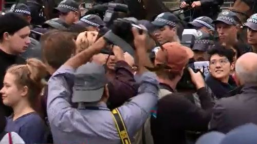 Protesters swarm outside Yiannopoulos's Sydney talk venue.