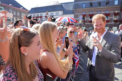 Prince Harry, Duke of Sussex is greeted by well-wishers outside the town hall during the Invictus Games Dusseldorf 2023 - One Year To Go events, on September 06, 2022 in Dusseldorf, Germany.  