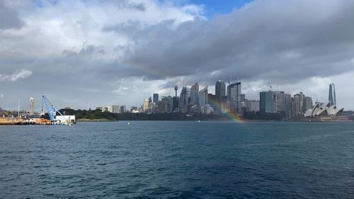 A rainbow in Sydney Harbour today, with Centrepoint Tower and the Opera House in the background.