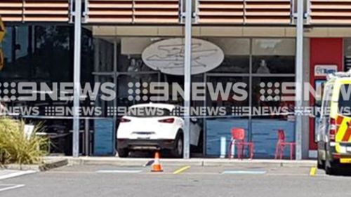 Car slams into ice-cream shop