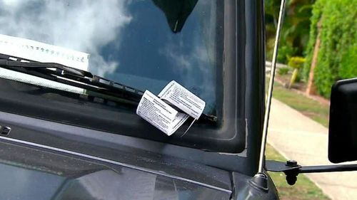 About $30 million in fines were collected in Brisbane City in the past financial year. Parking fine on car stock file 