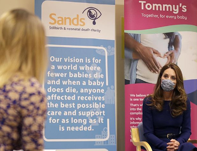 Kate Middleton speaks with staff for Baby Loss Awareness Week