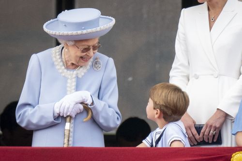 Queen Elizabeth II and Prince Louis watch from the balcony of Buckingham Place after the Trooping the Color ceremony in London, Thursday, June 2, 2022, on the first of four days of celebrations to mark the Platinum Jubilee. The events over a long holiday weekend in the U.K. are meant to celebrate the monarch's 70 years of service.