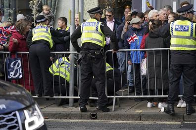 Police detain a protester after he appeared to throw eggs at King Charles III and the Queen Consort as they arrived for a ceremony at Micklegate Bar, where the Sovereign is traditionally welcomed to the city, in York, Wednesday November 9, 2022.