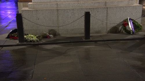 A man is alleged to have stolen flowers from a wreath and poured beer at the statue's feet. Picture: 9News