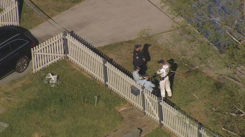 Police at the Faulconbridge home after two children were found dead inside. 