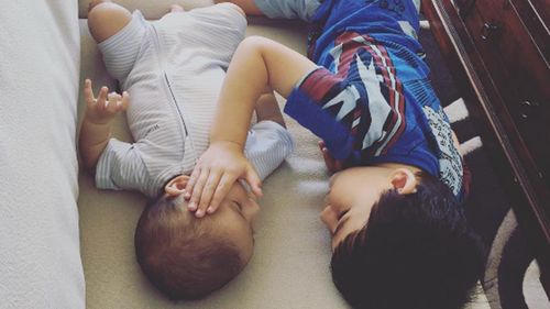 Boy comforts baby brother as he battles terminal cancer