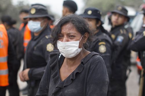 A woman in a mask to make breathing just possible in the hazardous atmosphere. Picture: AP