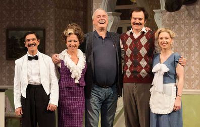 John Cleese (centre) who wrote the original BBC comedy series of Fawlty Towers with actors (from left to right) Syd Brisbane who plays Manuel, Blazey Best who plays Sybil, Stephen Hall who plays Basil and Aimee Horne who plays Polly.