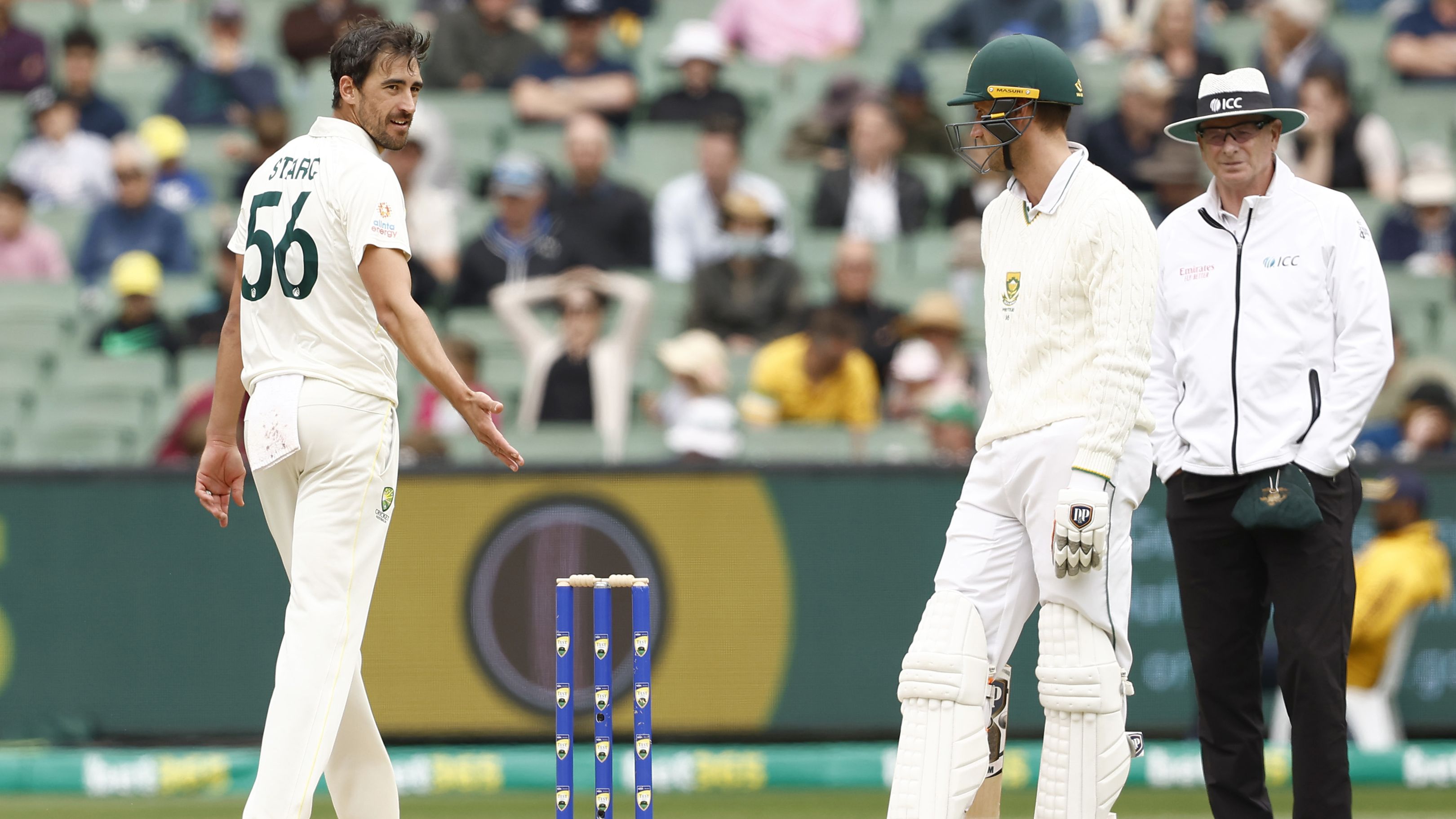 Mitchell Starc of Australia speaks to Theunis de Bruyn of South Africa about staying in his crease. (Photo by Darrian Traynor - CA/Cricket Australia via Getty Images)