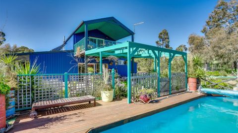 blue barn-style home under contract south australian village domain 