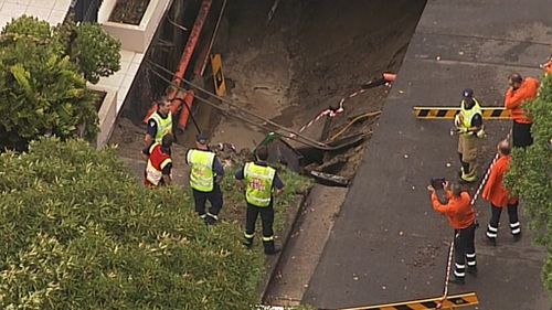 A street and footpath were closed as firefighters worked to stop the gas. (9NEWS)