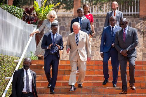 Prince Charles, in the middle, and Camilla, Duchess of Cornwall, top left, come to visit the Kigali Genocide Memorial in the capital, Kigali, Rwanda, on Wednesday, June 22, 2022.