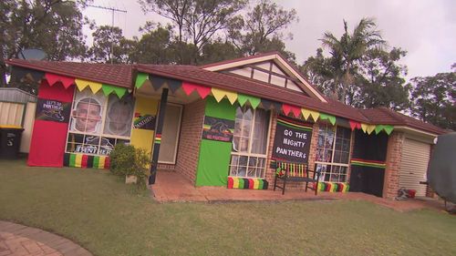 Super fan Annette has decked out her home in black, red, yellow and green.