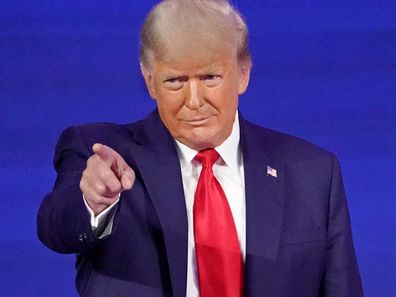 Former president Donald Trump points to cheering supporters as he is introduced before speaking at the Conservative Political Action Conference in February.