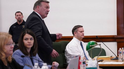 Chad Daybell listens to a motion by his defense attorney, John Prior, standing, to move his trial during a court hearing in St. Anthony, Idaho.