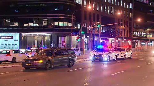 A man was rushed to hospital from St Leonards, in Sydney's North, after being struck by a car while crossing the Pacific Highway.