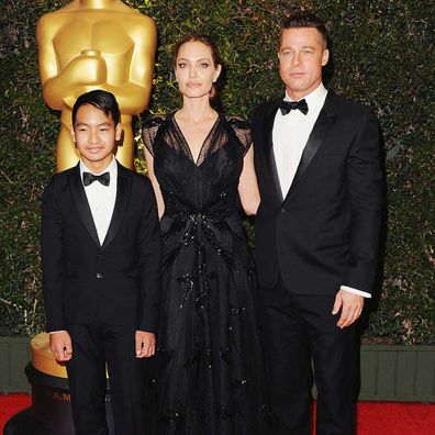 Angelina Jolie, Maddox Jolie-Pitt and actor Brad Pitt in 2013