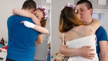 Oksana and Victor during their first dance after the bride lost both her legs on a Russian landmine in Lysychansk, Ukraine (Lviv Medical Association)