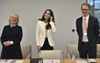 Kate, Princess of Wales, centre, gestures between Aviva chief executive officer Amanda Blanc, left, and Lego UK & Ireland vice president Christian Pau at NatWest's headquarters in London, Tuesday, March 21, 2023 as she hosts the inaugural meeting of her new Business Taskforce for Early Childhood 