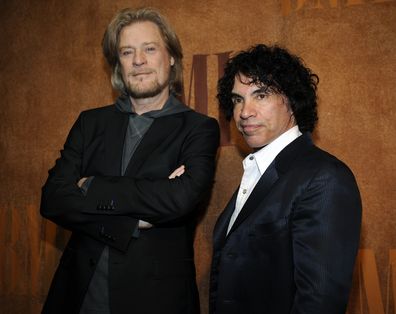 FILE - Daryl Hall, left, and John Oates, recipients of BMI Icons awards, pose together before the 56th annual BMI Pop Awards in Beverly Hills, Calif., on May 20, 2008.   Hall has sued his longtime music partner John Oates, arguing that his plan to sell off his share of a joint venture would violate a business agreement the duo had.(AP Photo/Chris Pizzello, File)