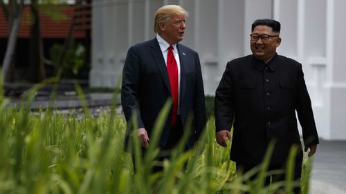 Donald Trump and Kim Jong-un appear jovial at the summit on Tuesday. Picture: AAP