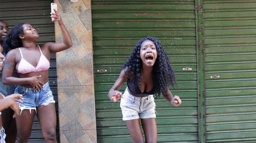 Residents protest a police operation targeting drug traffickers in the Jacarezinho favela of Rio de Janeiro.