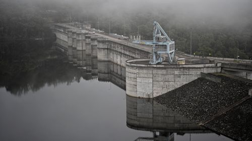 Warragamba Dam has started to spill over, as Sydney and the NSW South Coast brace for a day of severe weather.