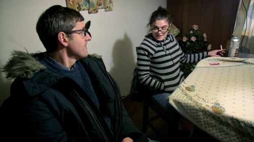 Theroux talks with someone whose life has been impacted by the opioid epidemic. (BBC)