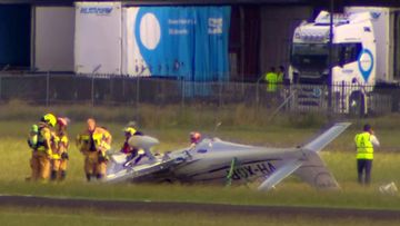 A light plane has crashed and flipped on the runway at Bankstown Airport.