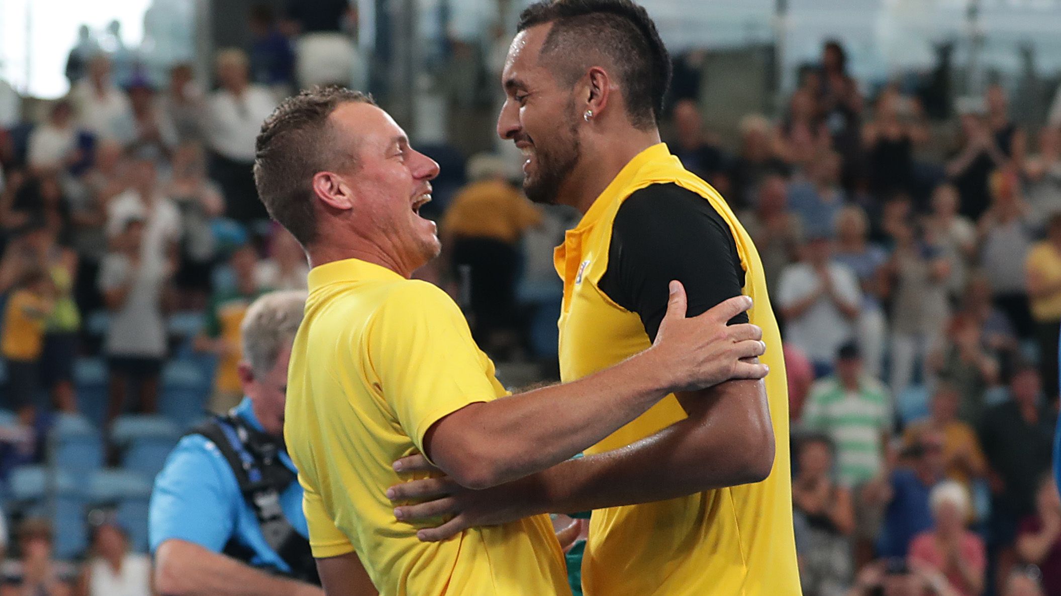 Lleyton Hewitt and Nick Kyrgios embrace during the ATP Cup.