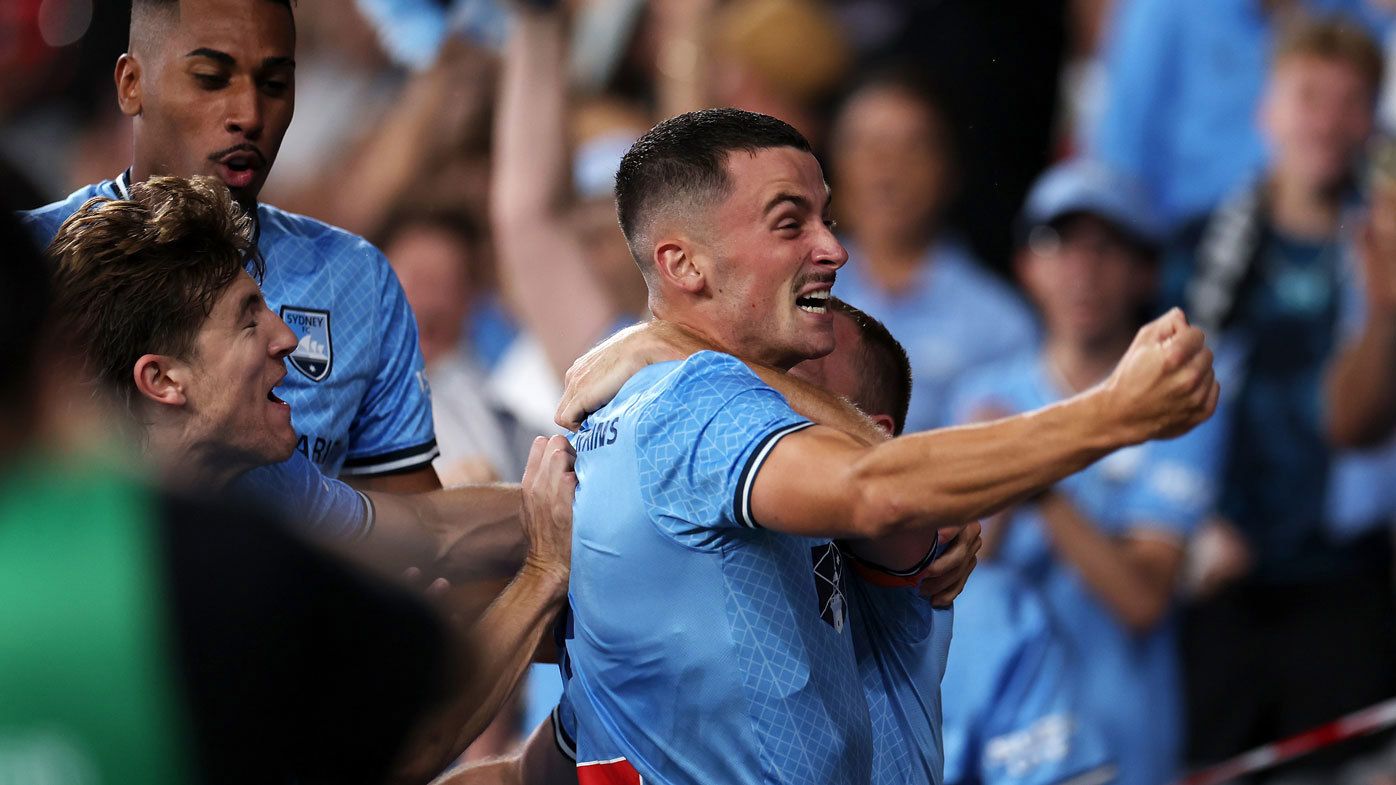 Jordan Courtney-Perkins and Rhyan Grant of Sydney FC celebrate with the crowd after Grant scoring a goal during the A-League Men round 19 match between Western Sydney Wanderers and Sydney FC at CommBank Stadium, on March 02, 2024, in Sydney, Australia. (Photo by Mark Kolbe/Getty Images)
