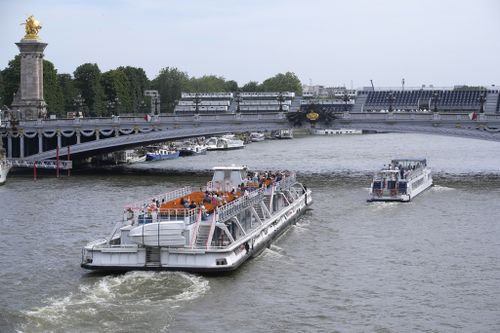 Tourists barges pass under the Alexandre III bridge, Friday, June 28, 2024 in Paris.