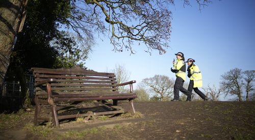 Police community support officers walk past the bench where missing Nicola Bulley's phone was found on February 09, 2023 in Preston, England.