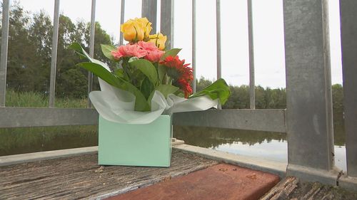 Flowers have been laid at the lake as the community mourns the loss of Fahim Wakili.