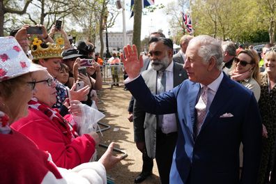 King Charles III greets members of the public along the Mall as preparations continue for The Coronation on May 5, 2023 in Londonm 