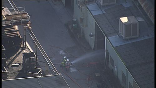 Up to 30 workers were forced to flee as 50 firefighters battled the blaze. Picture:9NEWS