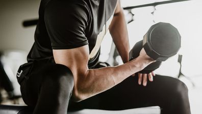 Man lifting weights in gym